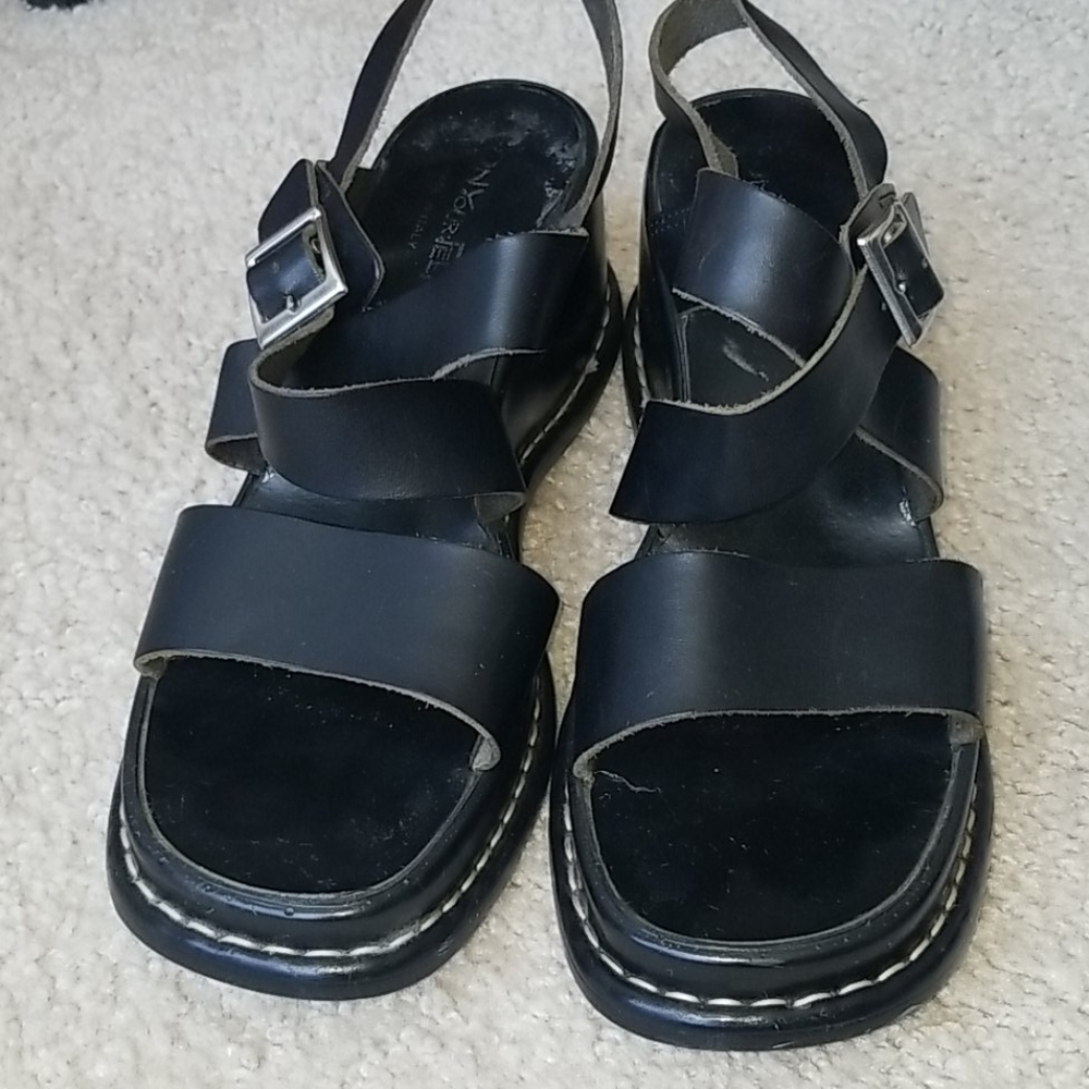Black leather shoes .